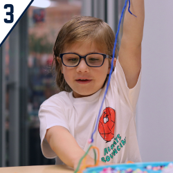 Image of student working on craft in classroom